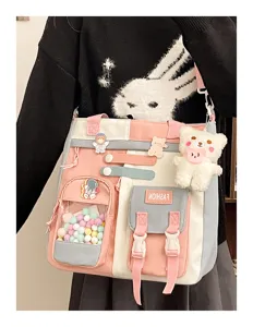 Sac bandoulière en toile mignon avec poche transparente, ours en peluche et blocs de couleur.