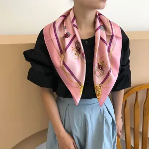 Luxury pink silk scarf for women featuring elegant carriage and chain pattern design.