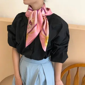 Luxury silk scarf for women, elegant pink square scarf featuring classic carriage print.