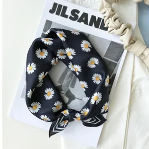 Silk square scarf with elegant white daisy print design, soft and smooth texture for women.