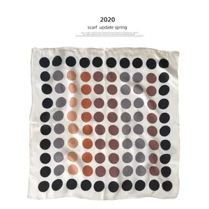 Elegant French style silk square scarf with modern geometric polka dot pattern for women.