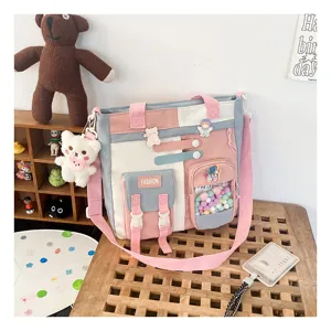 Joli sac cabas en toile multi-poches pour étudiants, grand sac bandoulière pratique.