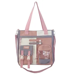 Sac bandoulière détaillé en toile, élégant cabas multi-poches pour les étudiants.