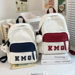 Mochila ligera para niños bolsa escolar linda mochila informal con bolsillo frontal y peluche.
