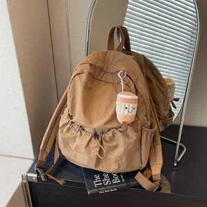 Korean niche design nylon backpack lightweight casual travel bookbag for students and outdoor use.