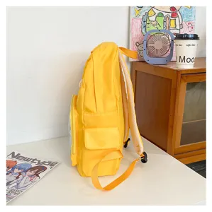 Gele ita rugzak zijaanzicht met doorzichtig voorvak, stijlvolle canvas studenten schooltas.