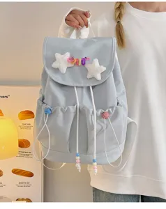 Cute Japanese style light blue backpack with plush star and colorful beads for daily use.
