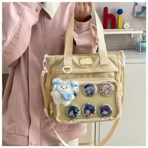 Beige corduroy ita tas met transparant venster en schattige pluche hanger voor studenten.