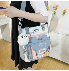 Bolso bandolera de lona para estudiantes con orejas de conejo y colgante de peluche.