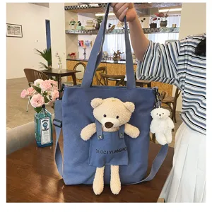 Bonito bolso tote de lona azul con un tierno osito de peluche, elegante bolso cruzado.