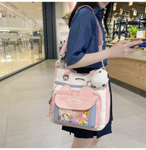 Bolso bandolera de lona lindo con orejas de conejo y bolsillo transparente para estudiantes.