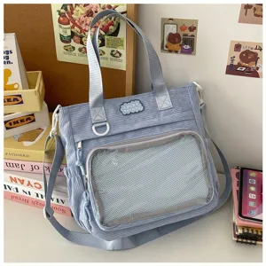 Blauwe corduroy ita tas crossbody schoudertas met transparant voorvenster voor studenten.