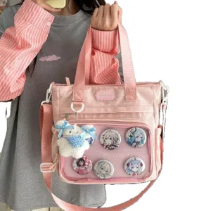 Roze corduroy itabag schouder crossbody tas met transparante mesh zak voor anime pins.