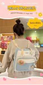 Grand sac à dos scolaire pour filles, joli cartable en toile avec pendentifs pour les études.