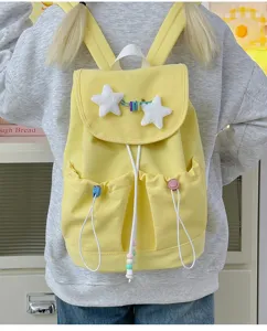 Cute Japanese yellow school backpack for teen girls, lightweight casual star canvas bookbag.