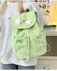 Detailed view of cute light green casual backpack with fluffy plush stars, casual style for students.