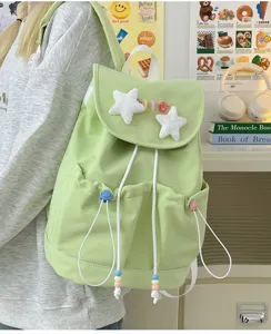 Cute Japanese style casual canvas backpack featuring lovely plush star decorations.