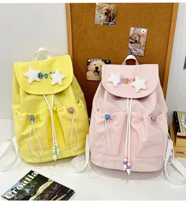 Detail view of cute Japanese style casual backpack with star decor in a bright scene.