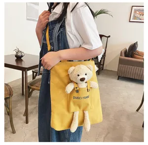 Bolso cruzado de lona para mujer, lindo colgante de oso de peluche, bolso casual diario, amarillo.