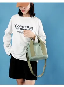 Μικρή πράσινη τσάντα καμβά tote με λουράκι ώμου, casual γυναικεία τσάντα χειρός λεπτομέρεια.