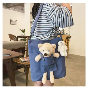 Bolso cruzado de lona con lindo oso de peluche y colgante para uso diario y estilo.