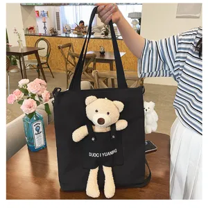 Bolso tote de lona negra con adorable peluche de osito, bolso casual elegante para estudiantes.