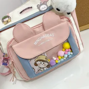 Bolso bandolera de lona rosa con orejas de conejo y ventana transparente para estudiantes.