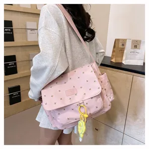 Pink floral messenger bag detail shot, large capacity casual canvas cross body bag for students.