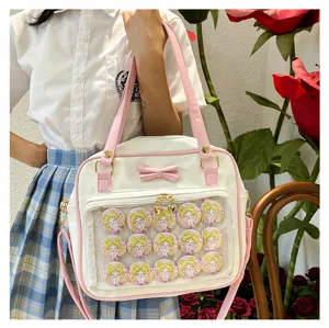Cute white pink JK uniform ita bag with bow and transparent badge display window for anime fans.