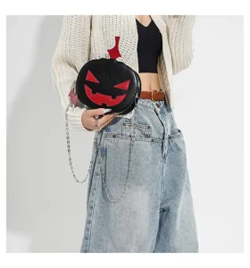 Halloween pumpkin crossbody bag with chain strap, black and red PU leather spooky fashion purse.