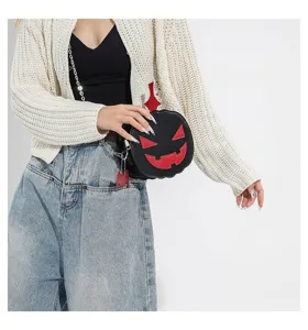 Detailed close-up of the Halloween pumpkin crossbody bag showing unique color-blocked design.