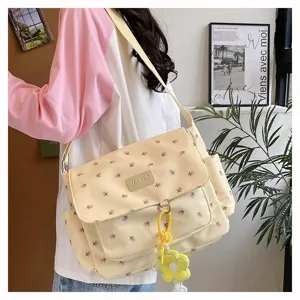 Canvas messenger bag for women with floral print, large capacity casual crossbody bag for daily use.