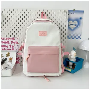 Pink and white color block student backpack with front pocket and cute style design for daily use