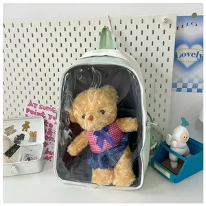 Detailed view of the clear front ita backpack in light green, perfect for displaying plush dolls.