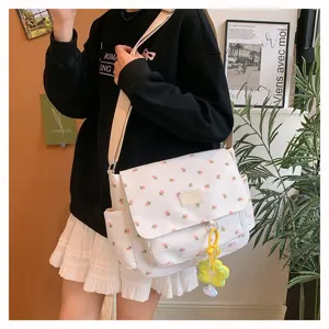 Detailed view of Japanese floral canvas messenger bag showing large capacity and side pockets.