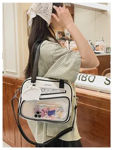 Piccola borsa ita in stile giapponese con finestra trasparente e tracolla per uso quotidiano.