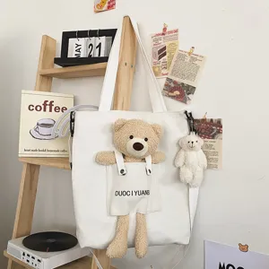 Lindo bolso de lona con detalles de bolsillo de muñeco de osito de peluche 3D estilo japonés.