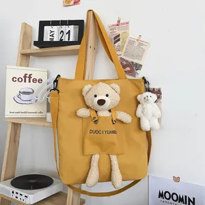 Lindo bolso de hombro de lona estilo japonés con muñeco de peluche de oso tierno.