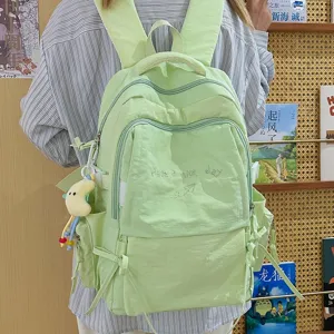 Lichte groene studentenrugzak, grote capaciteit casual tas voor school, reizen en laptop.