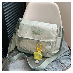 Light green floral canvas messenger bag detail shot, sweet style shoulder crossbody bag.