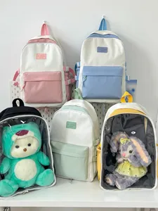 Japanese style transparent ita backpack student school bag with cute doll window display.