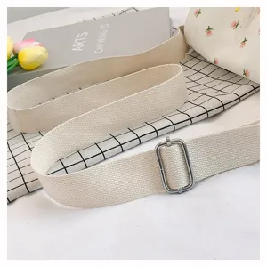 Japanese style floral canvas crossbody bag with wide strap and adjustable metal buckle.