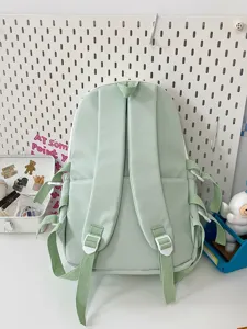 Detailed view of the Japanese style student backpack, featuring multi straps and light green tone.