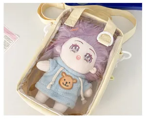 Clear detail shot of a cute transparent ita crossbody bag showcasing a plush cotton doll inside.