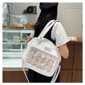 White PU leather ita bag with clear window and cute bow for anime badges and pins.