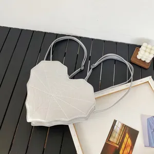 Goth spiderweb heart shoulder bag, cool alternative PU leather backpack for women.