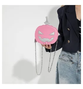 Pink pumpkin shoulder bag with silver chain, cute Halloween crossbody bag for women.