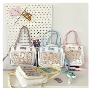 Cute PU leather Ita bag transparent window shoulder handbag with sweet bow and badges decor.