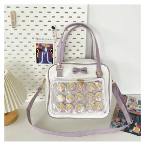Cute white and purple ita bag with clear window and bow, perfect for anime pins and daily use.