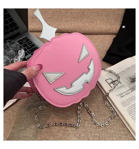 Detailed view of the cute pink Halloween pumpkin shoulder bag with silver chain and unique design.